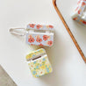 flowers airpods case boogzel apparel
