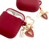 red airpods case with heart charm lulucases